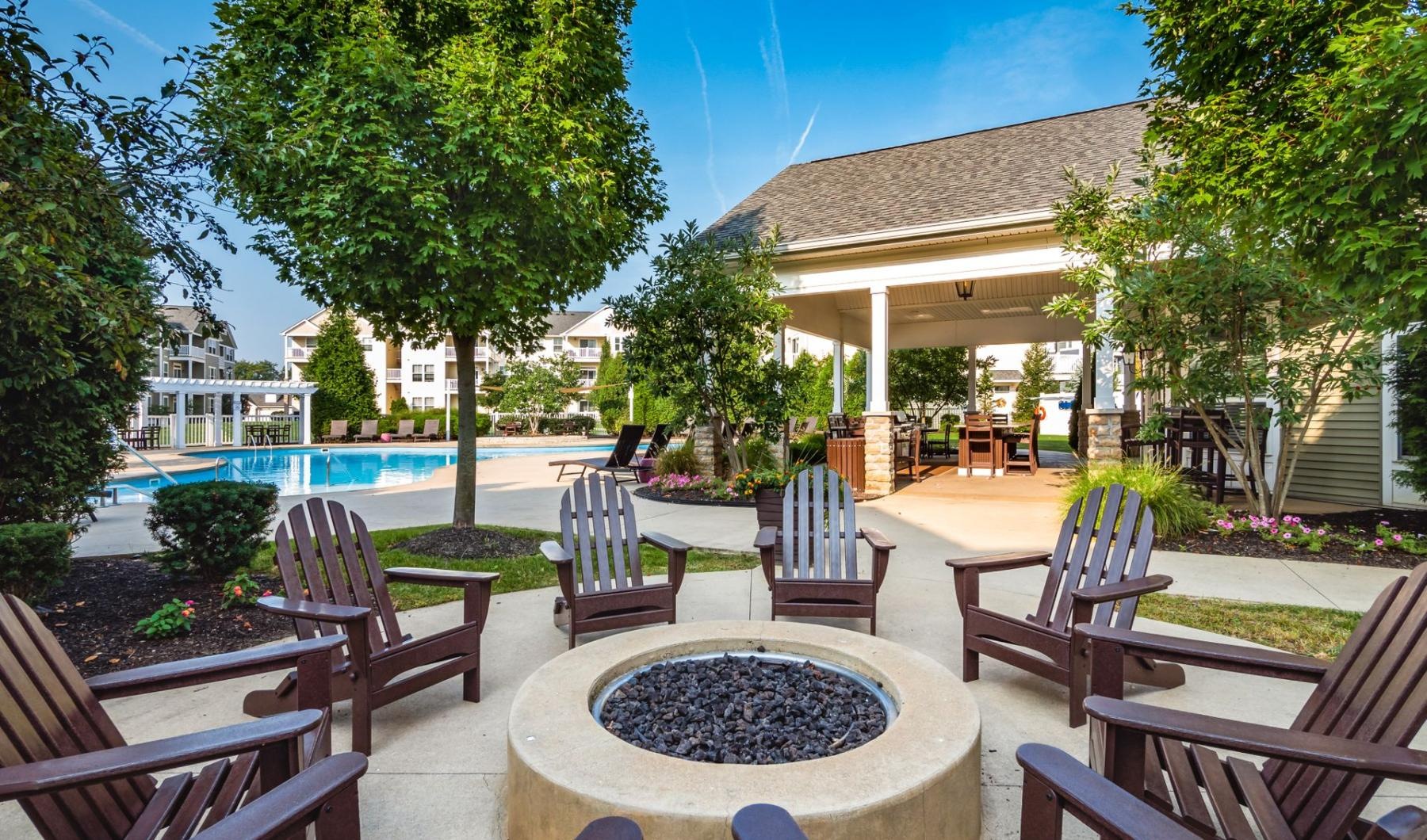 a patio with chairs and tables
