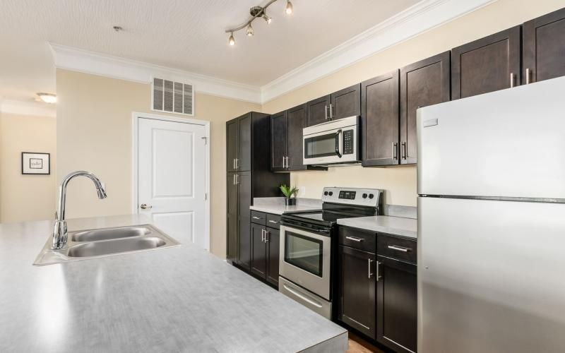 a kitchen with black appliances