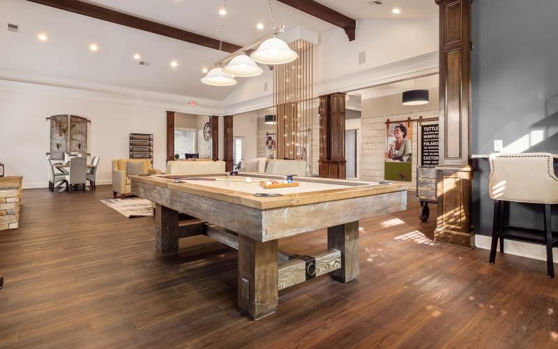 a large kitchen with a wood floor