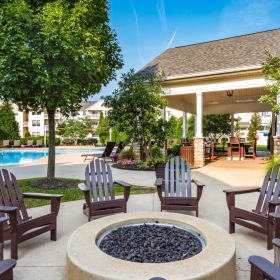 a patio with chairs and tables
