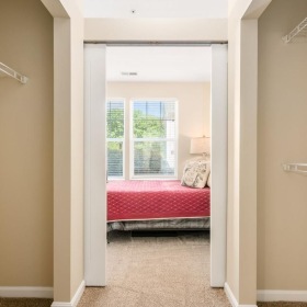 a bedroom with a bed and a window