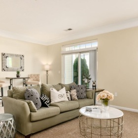 a living room with a couch and a table